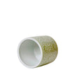 Green ceramic cup with white interior on a whitie background