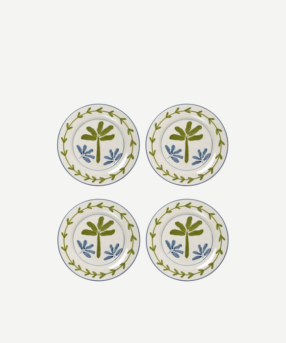 Four decorative plates with leaf patterns on a white background