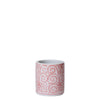 Ceramic mug with red pattern on a white background