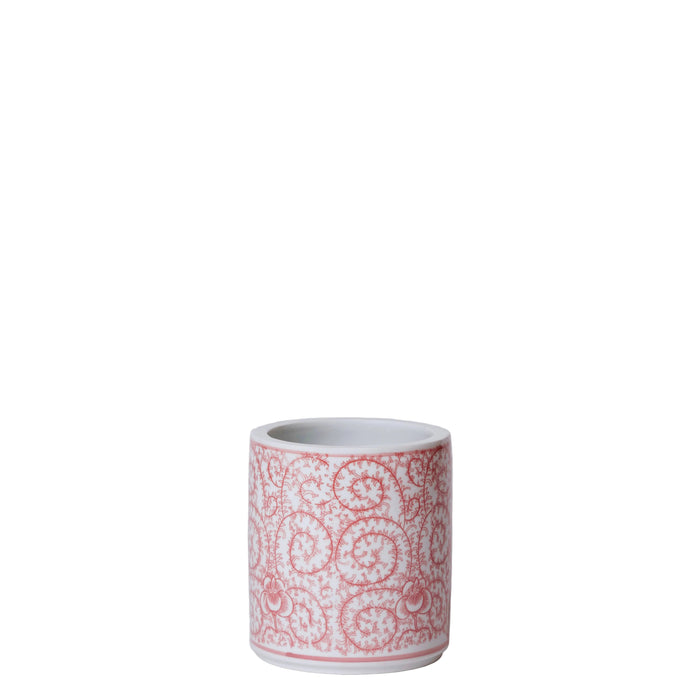 Ceramic mug with red pattern on a white background