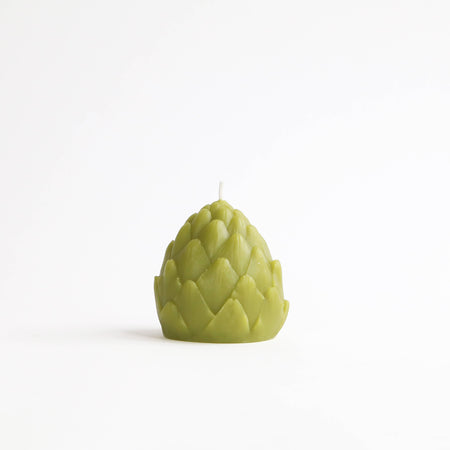 Artichoke-shaped candle on a white background