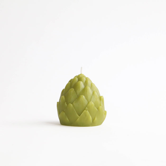 Artichoke-shaped candle on a white background