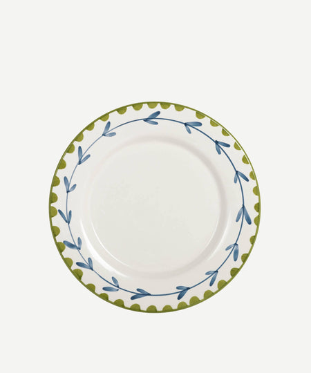 White plate with green and blue decorative rim on a white background