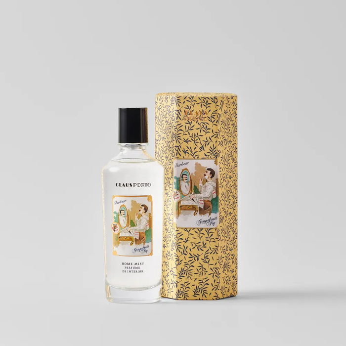 Perfume bottle with decorative packaging on a light gray background