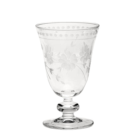 A clear crystal goblet with an etched floral pattern.