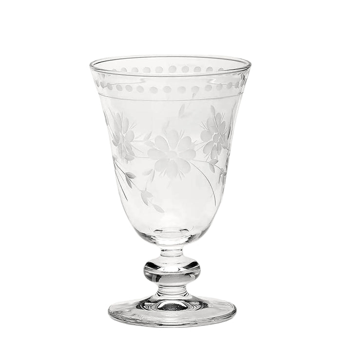 A clear crystal goblet with an etched floral pattern.