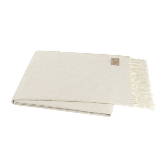 Beige blanket with fringe on a white background