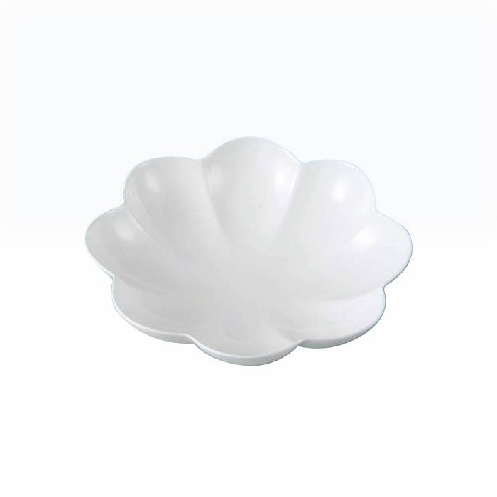 White serving bowl with bloom detail on white background