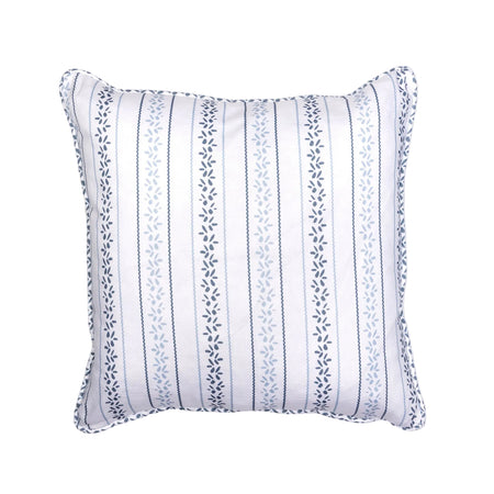 A square-shaped throw pillow with a blue floral petal pattern and a piped edge finish.