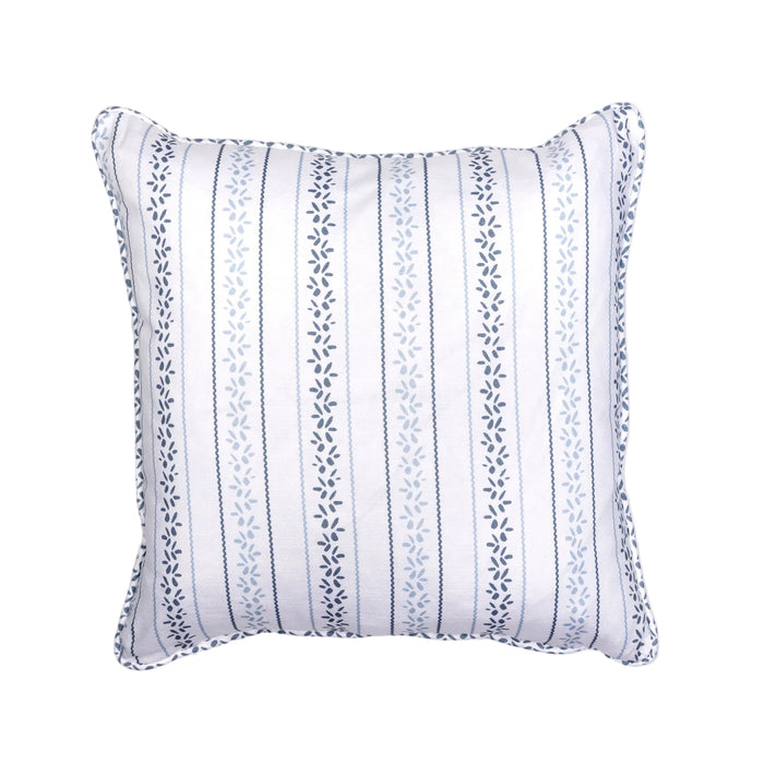 A square-shaped throw pillow with a blue floral petal pattern and a piped edge finish.