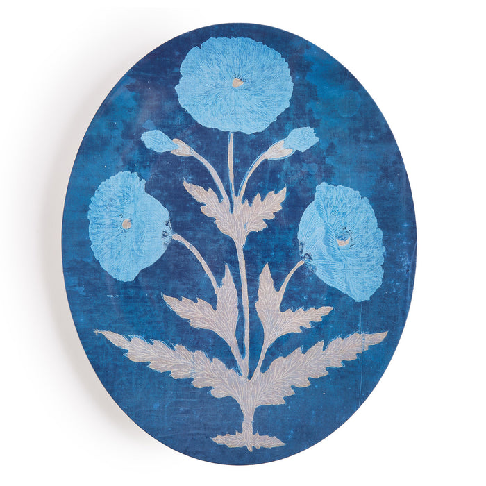 Decorative plate with blue floral design on a blue background