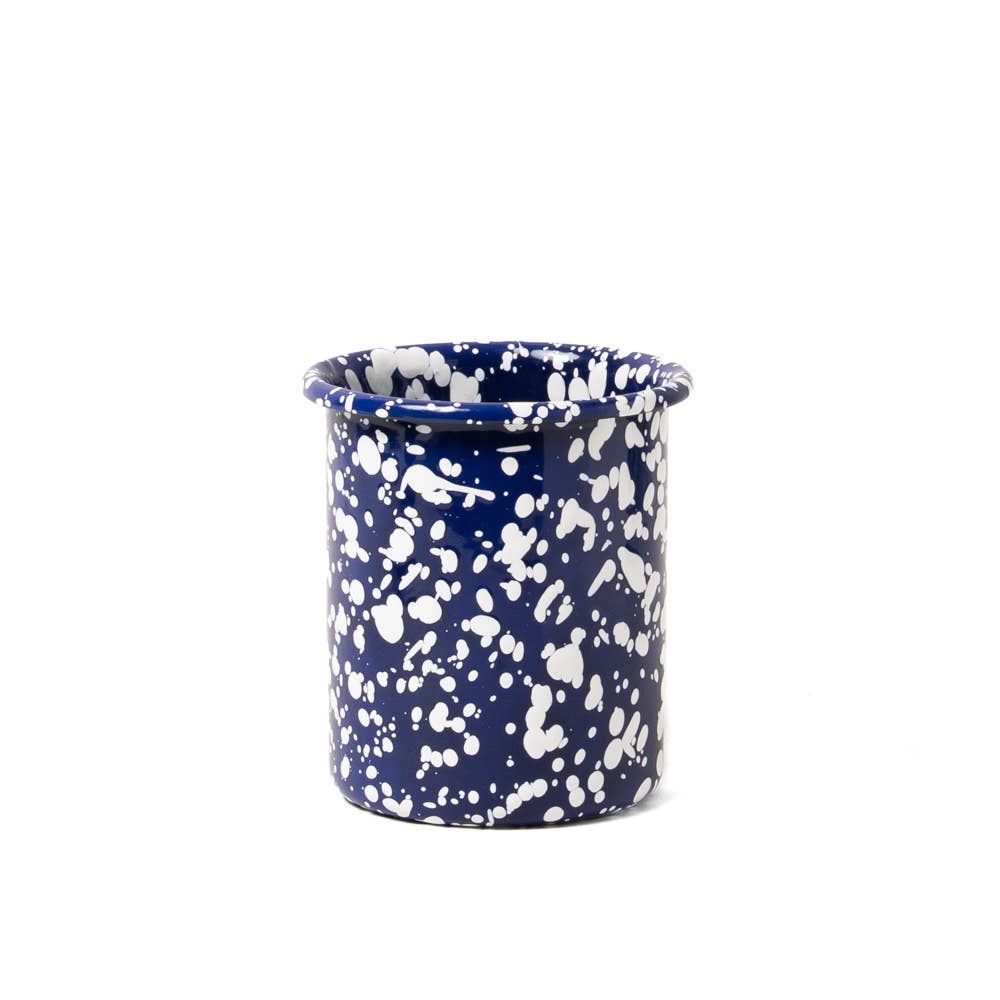 Blue and white speckled ceramic cup on a white background