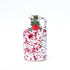 Bordeaux splatter ceramic bottle of extra virgin olive oil with cork on white background 