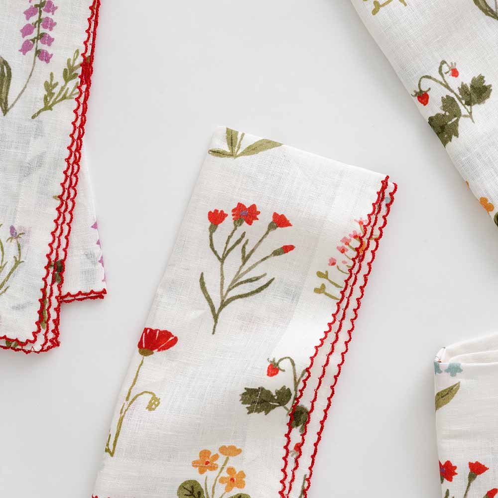 Linen napkins with a bouquet garden design on a white background