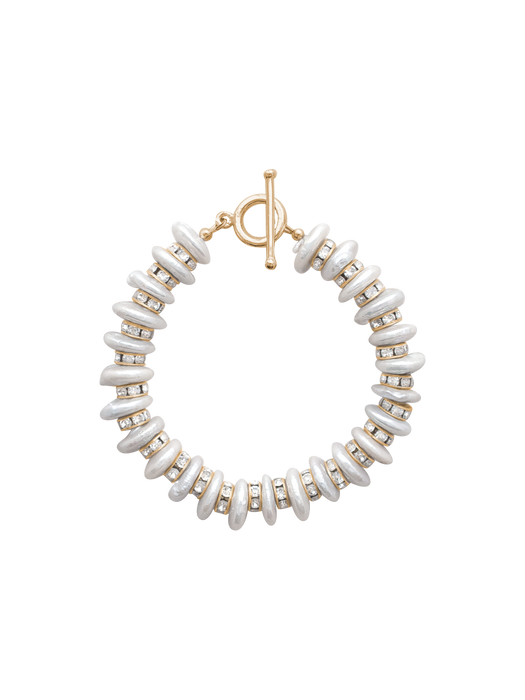 Bracelet with white beads and gold accents on a white background