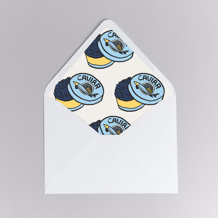 Sticker with caviar design on a white card against a gray background