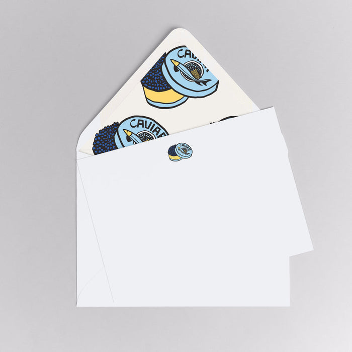 Set of stickers with a rocket design on a white card and envelope.