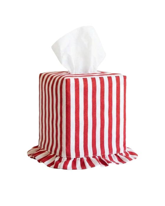 Red and white striped tissue box cover with tissues on a white background