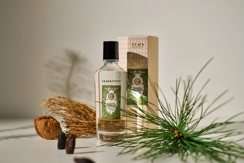 Cosmetic bottle with packaging and decorative elements on a neutral background