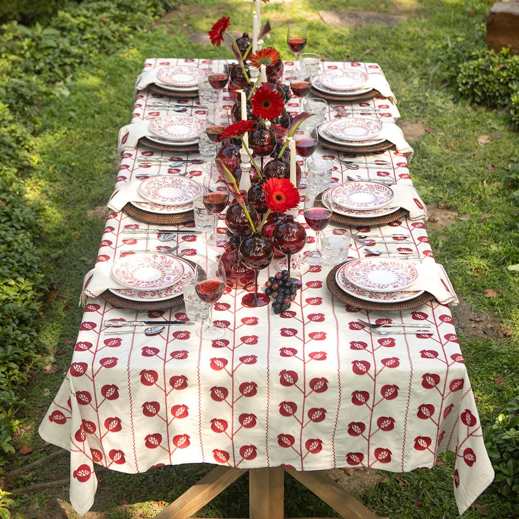 Crewel Burgundy tablecloth on table