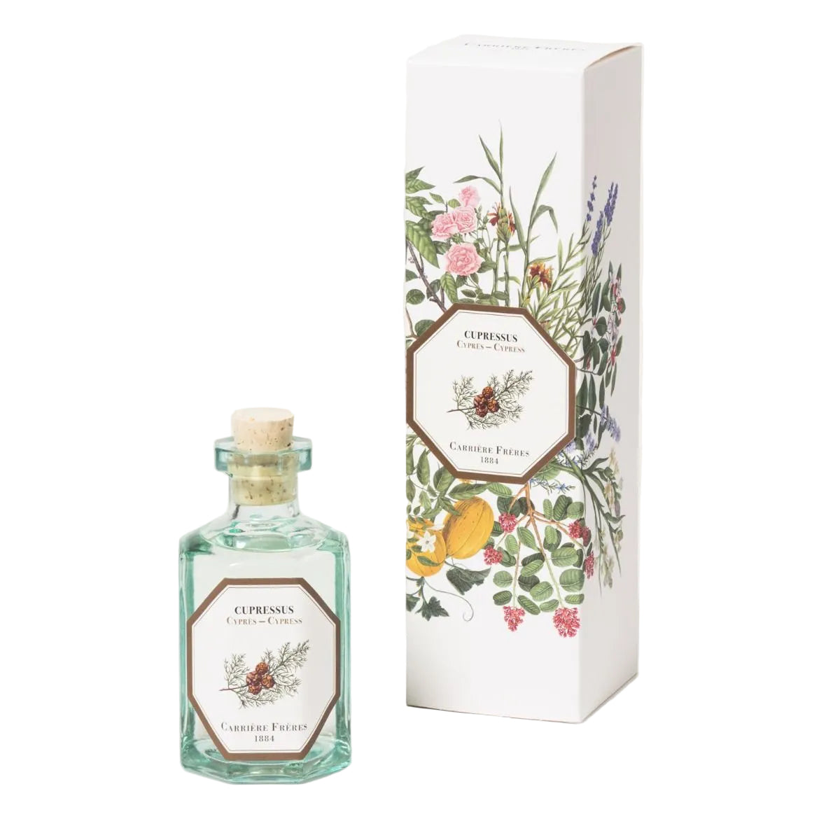 A clear glass bottle with a cork stopper, filled with liquid, next to its packaging box adorned with botanical illustrations.