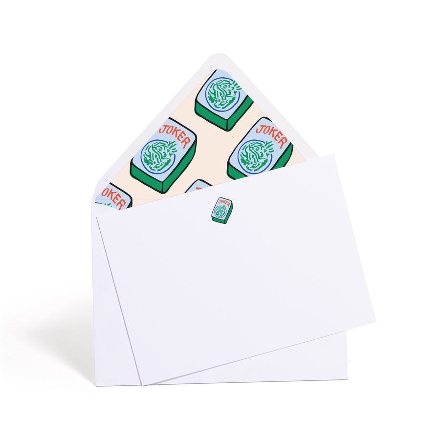 Two playing cards with joker symbols on a white background
