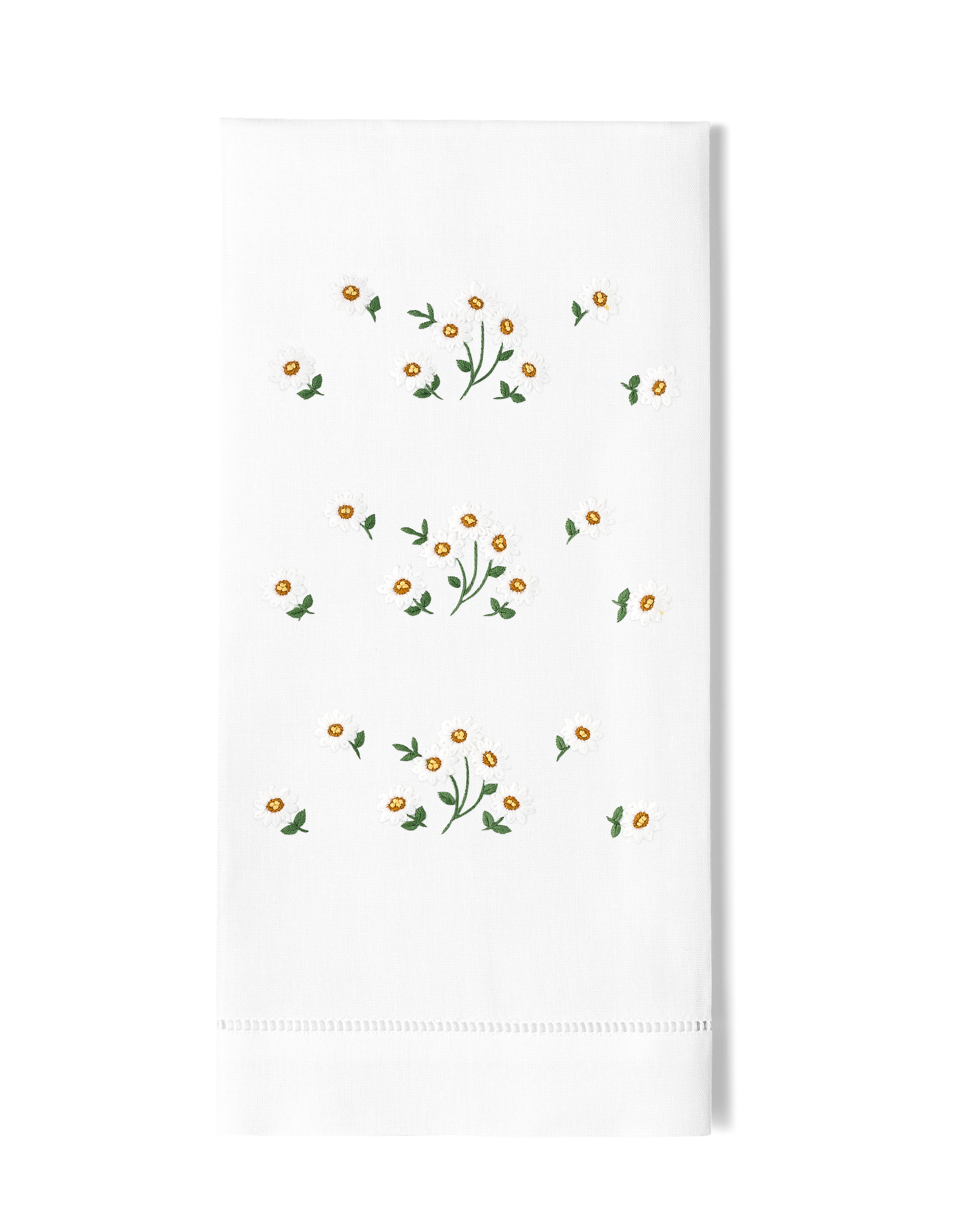 White tea towel with daisies scattered on 