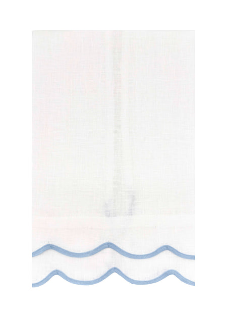 White towel with blue wave design at the bottom on a white background