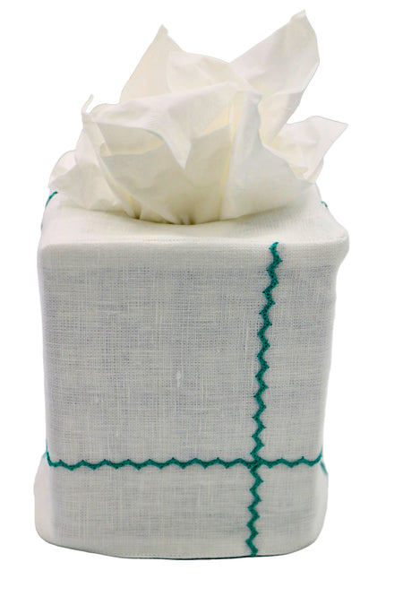 Tissue box with white tissues on a gray background