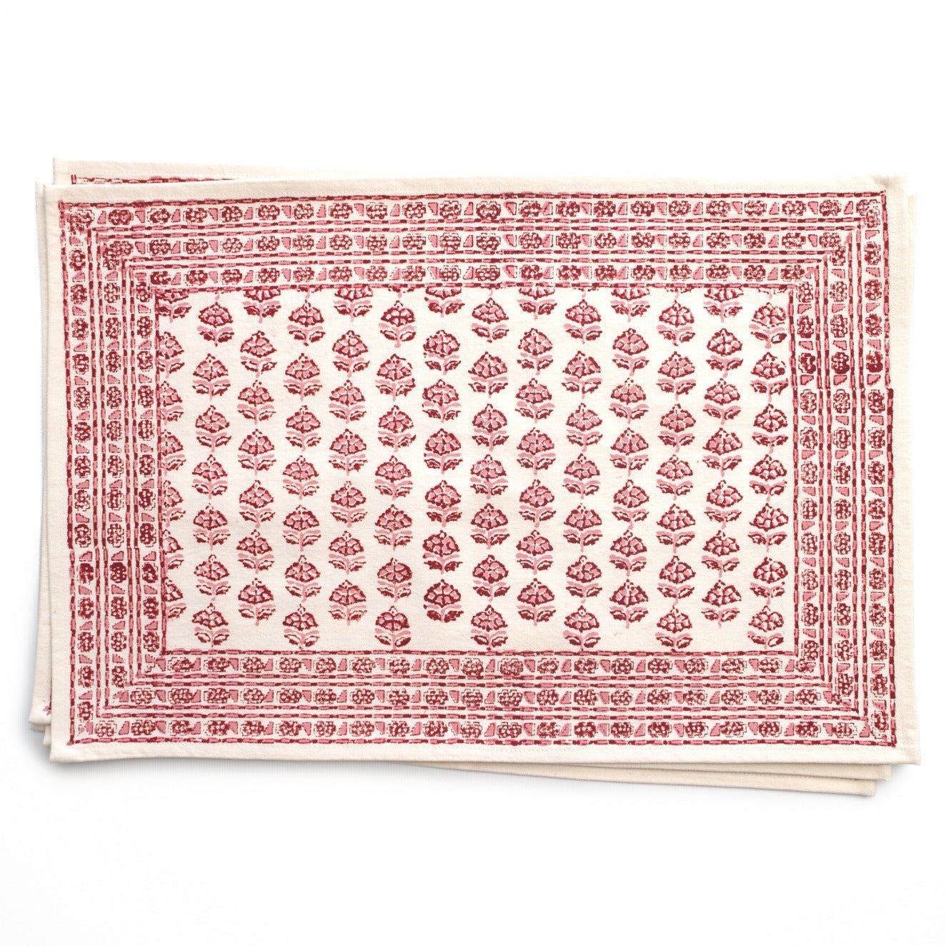 Placemats with soft rose tones on white background