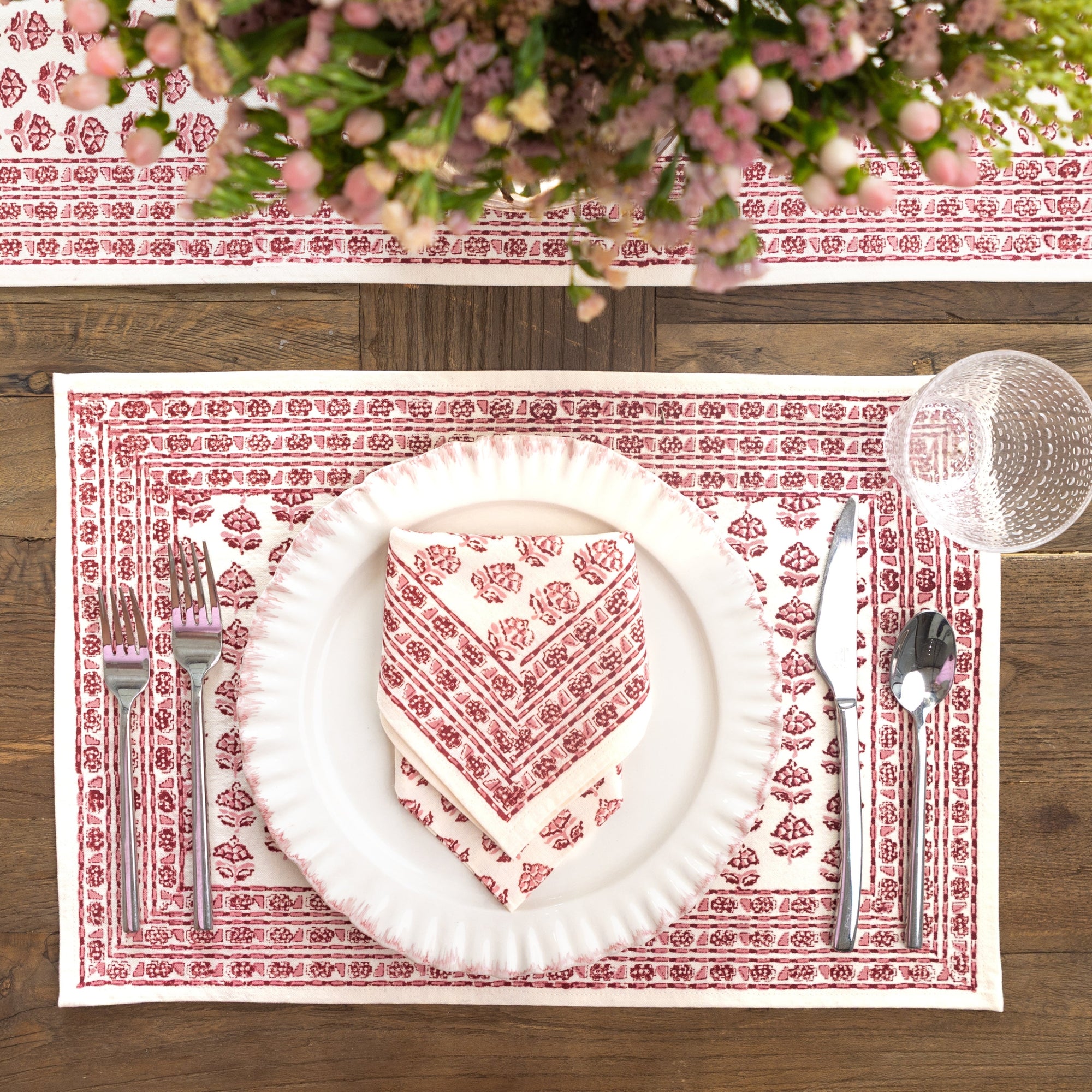Placemat with soft rose tones on table setting 