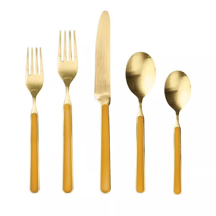 Fantasia Ice Oro flatware set in Mustard with 2 forks, a knife and 2 spoons on white background 