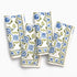 Set of four floral patterned napkins on a white background