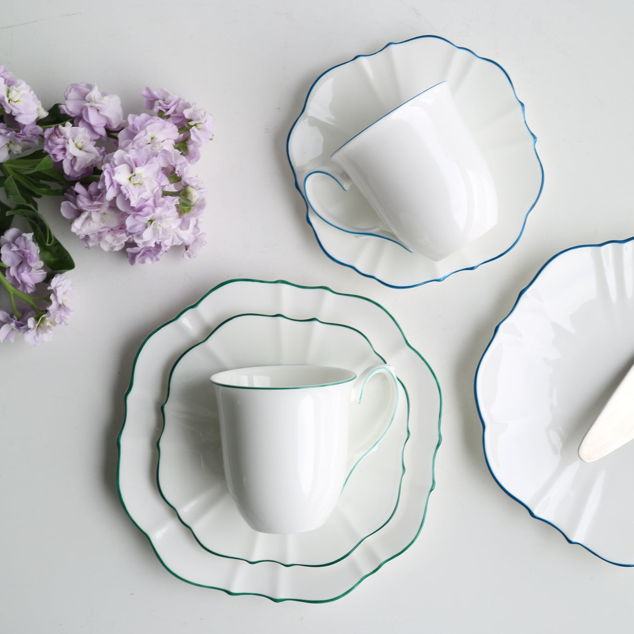 Forest Green trim mug on plates with grey background 