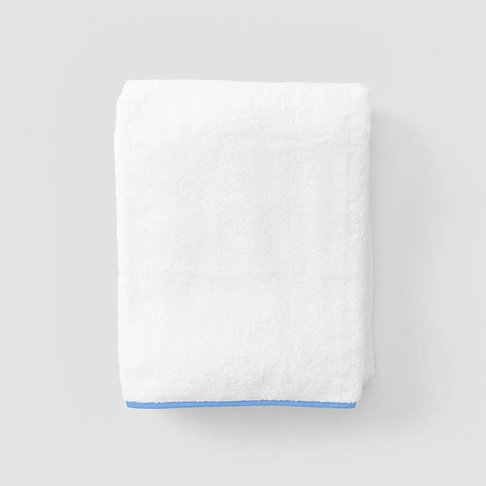 Towel with french blue piping on grey background