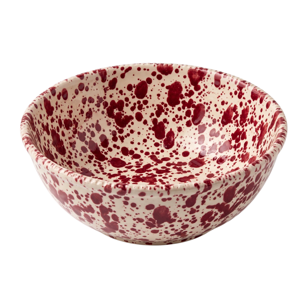 Homeport handmade ceramic serving bowl with a cream base and bordeaux red splatter pattern and textured rim.
