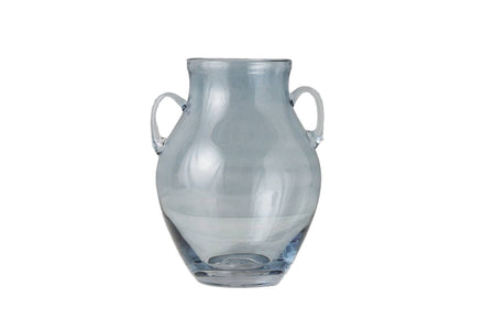 Clear glass vase with handles on a light gray background