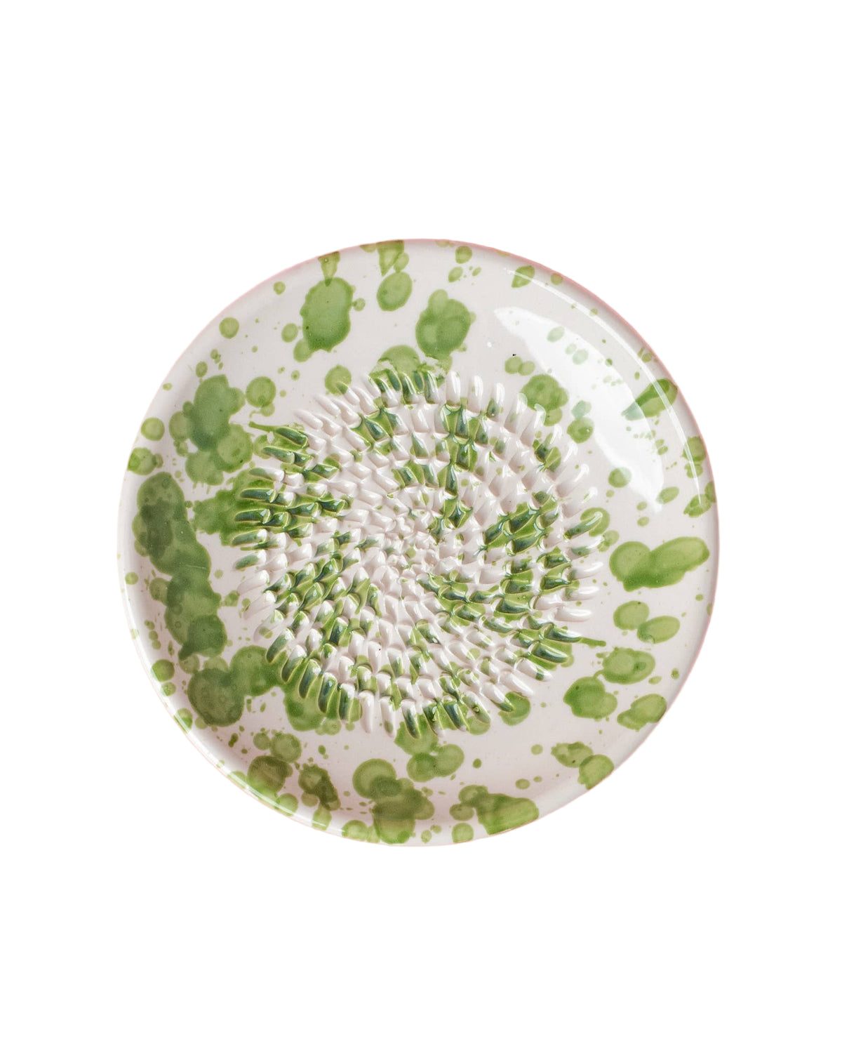 Green and white splatter ceramic grater plate on white background 