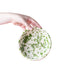 Grater Bowl with green and white splatter design on white background 