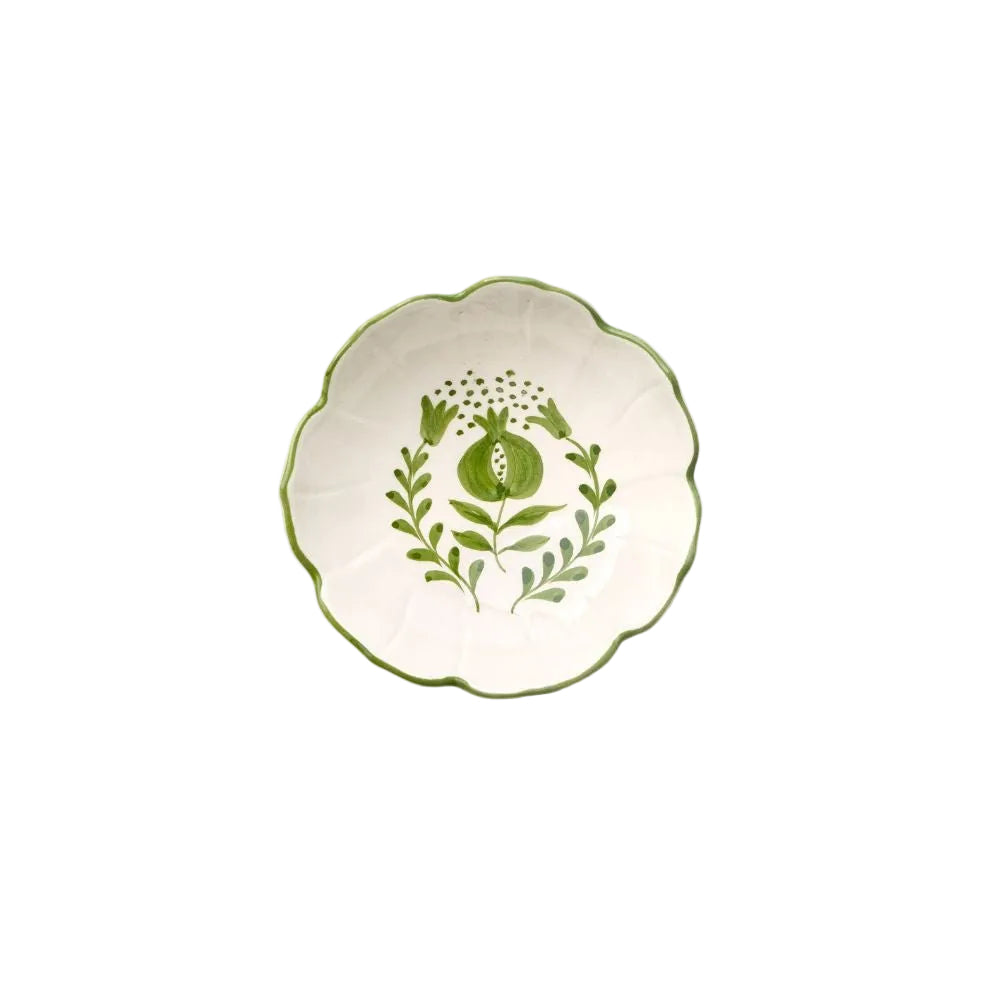 Decorative ceramic plate with green floral design on a white background