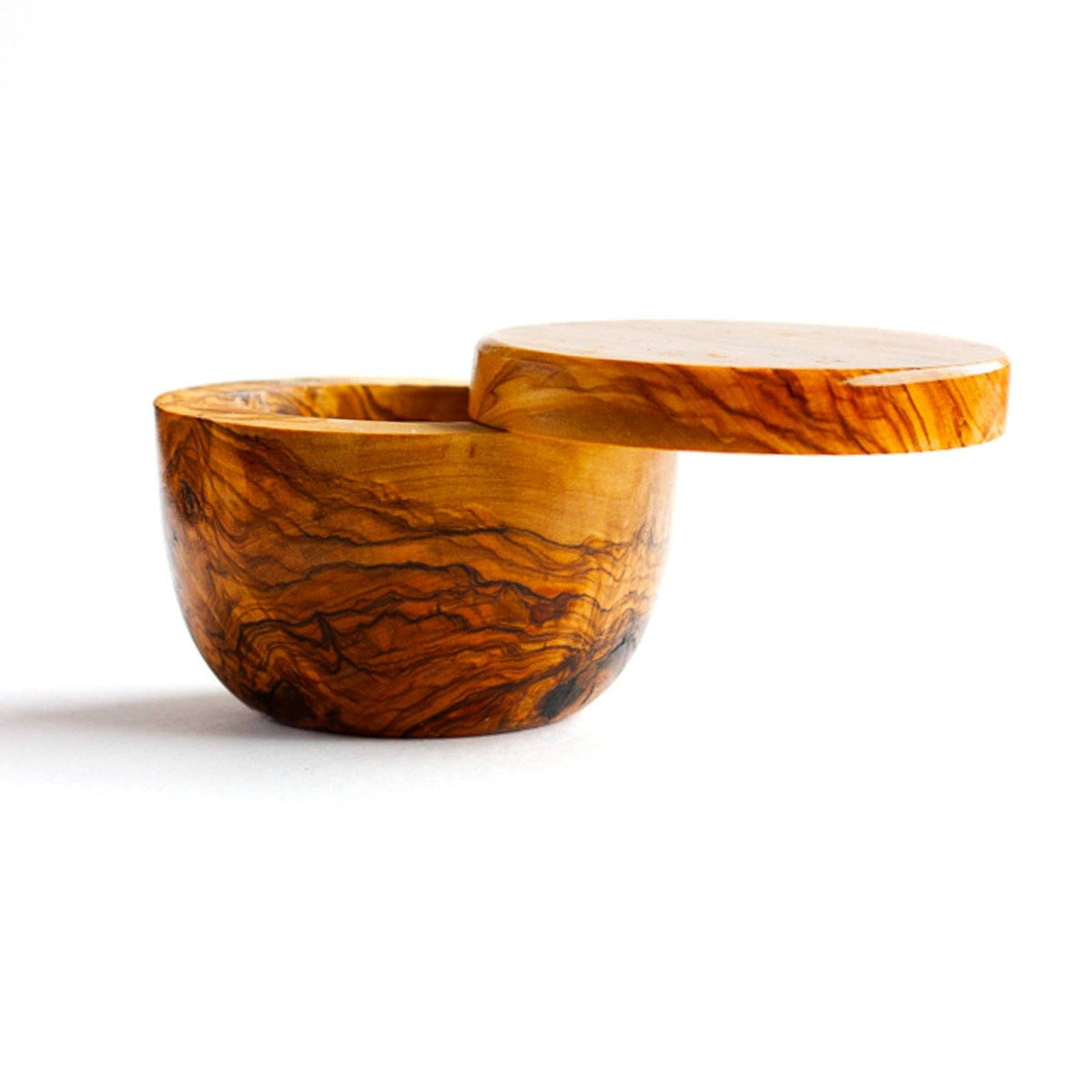 Salt cellar made of olive wood with swivel top on white background 