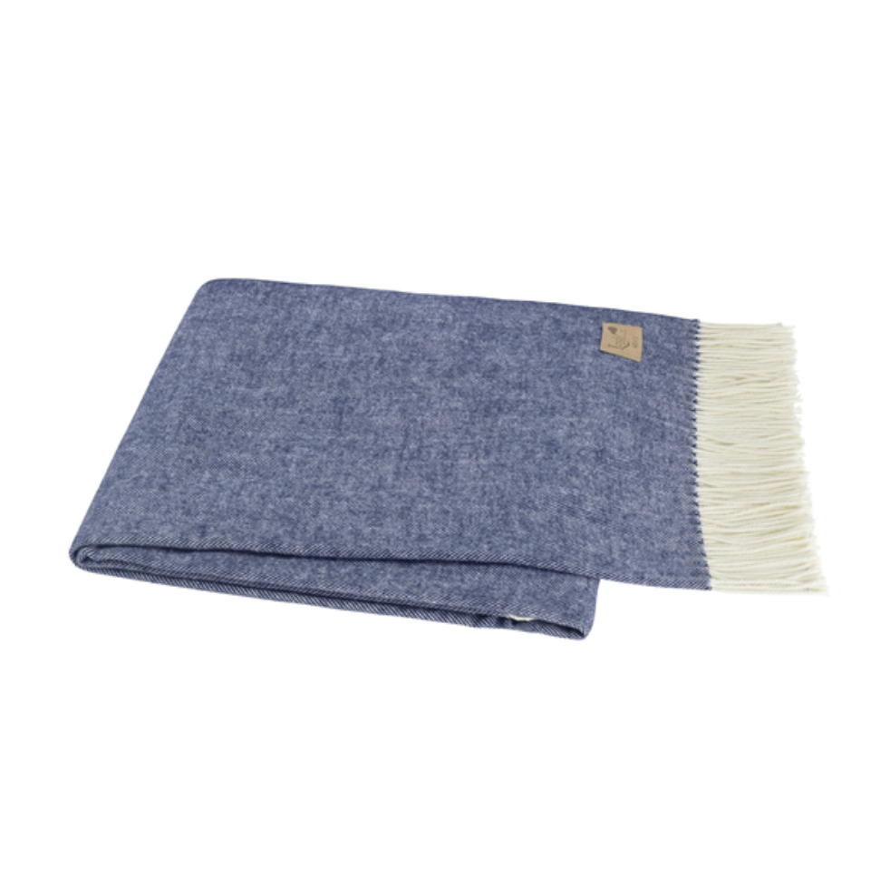 Blue blanket with white fringe on a white background
