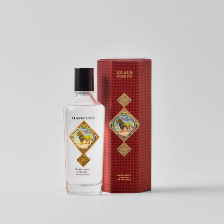 Bottle of Claus Porto eau de toilette with its red box on a white background