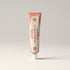 Tube of 'La Vie en Rose' cream on a light gray background