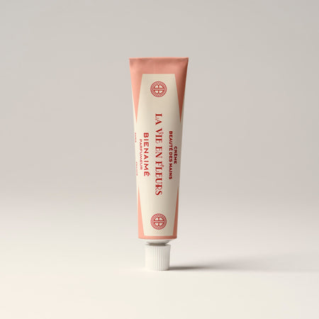 Tube of 'La Vie en Rose' cream on a light gray background