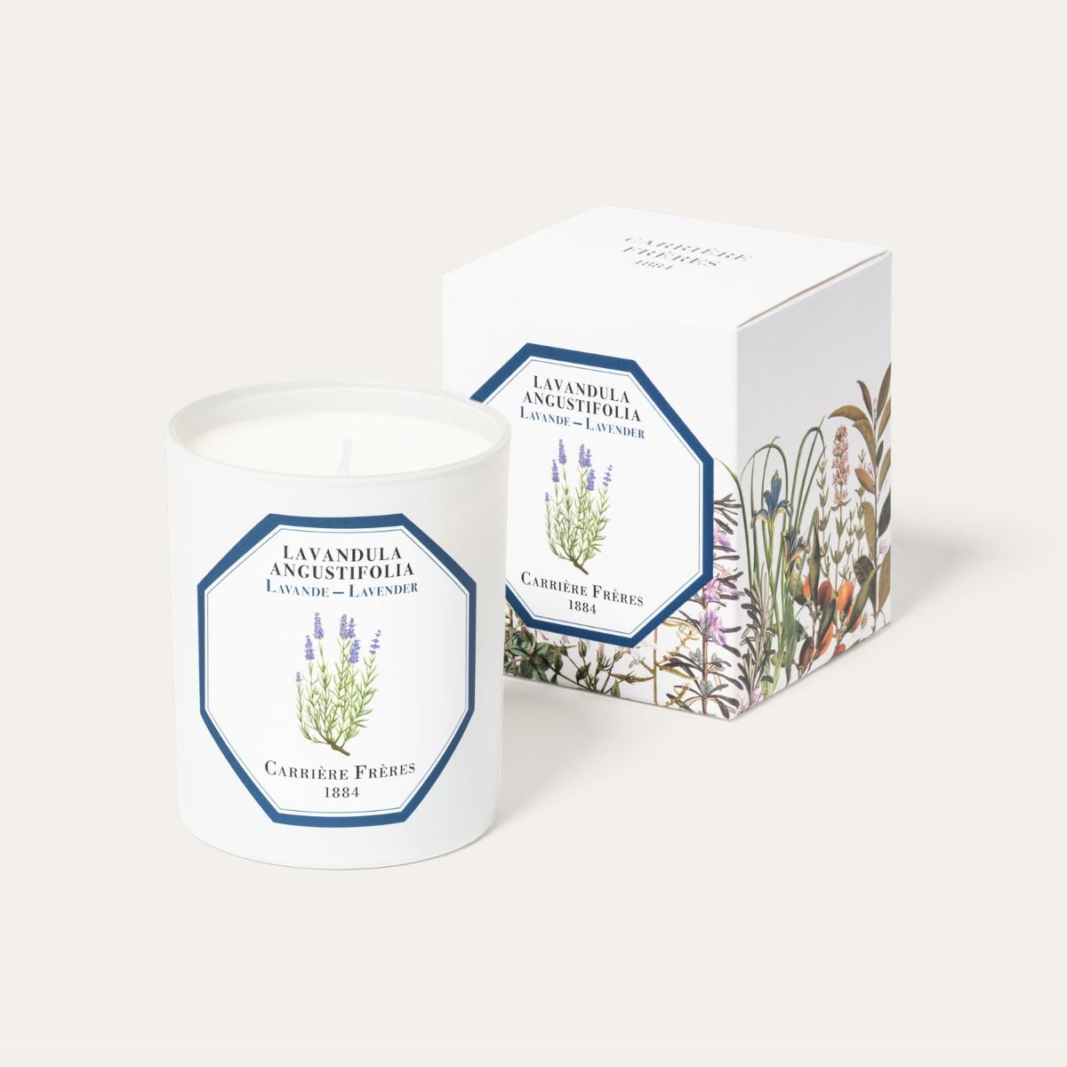 Candle with a botanical label and matching packaging on a white background