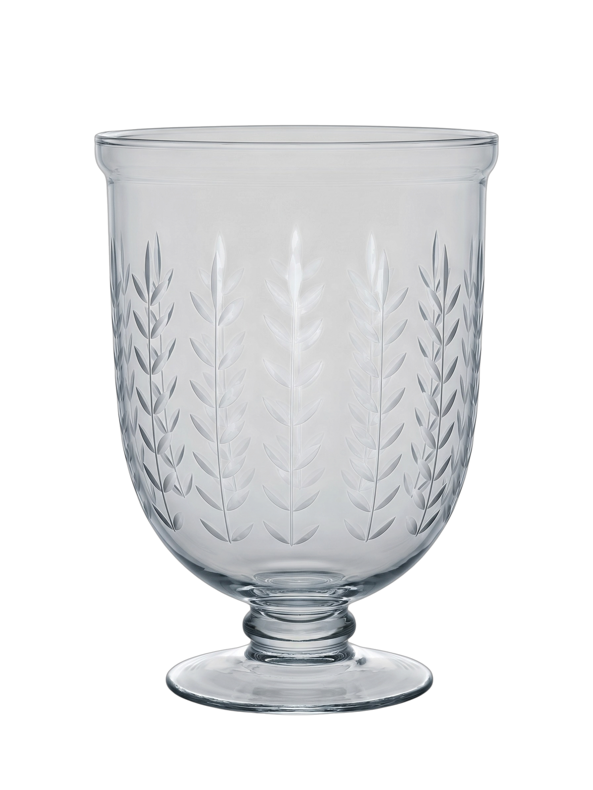 Clear glass pedestal cup with etched leaf patterns, shown on a solid white background.