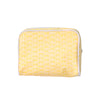 Yellow patterned pouch on a light gray background