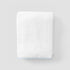 Towel with piping on grey background 