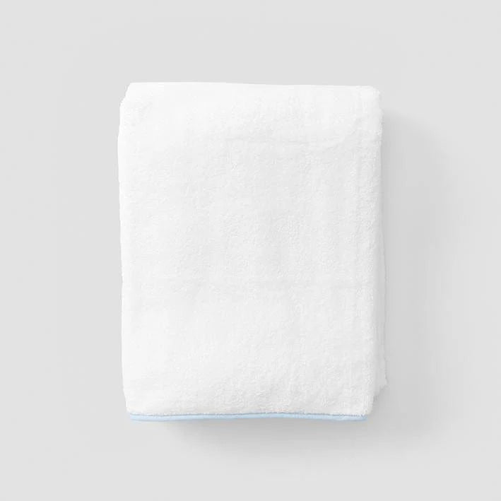 Towel with piping on grey background 